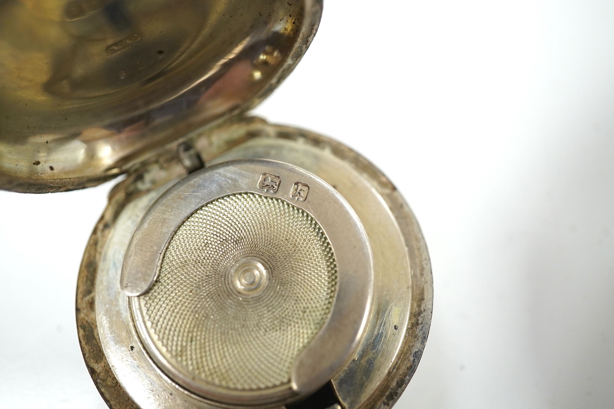 A George V Brittania standard silver two handled cup, Thomas Bradbury & Sons, Sheffield, 1922, height 49mm, two associated sections of a travelling watch case, with an Elkington nickel cased pocket watch, an Edwardian en